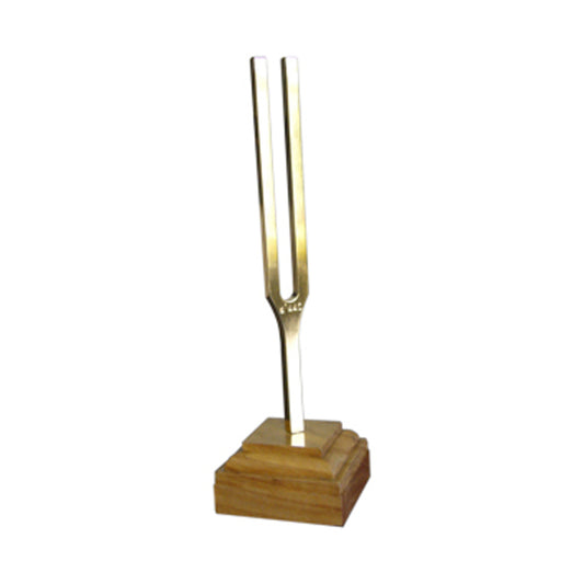Golden Barthelmes tuning fork a1 440 Hz on a wooden base